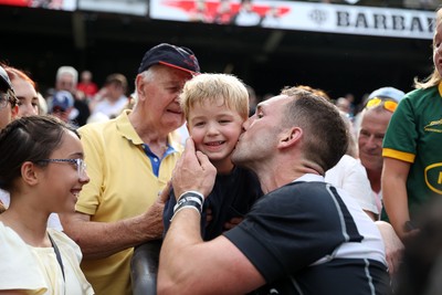 270626 - Barbarians v Wales - Friendly - George North of Barbarians with his son at full time