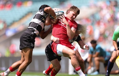 270626 - Barbarians v Wales - Ellis Mee of Wales is tackled by Faf de Klerk of Barbarian FC