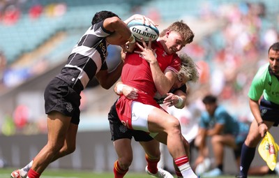 270626 - Barbarians v Wales - Ellis Mee of Wales is tackled by Faf de Klerk of Barbarian FC