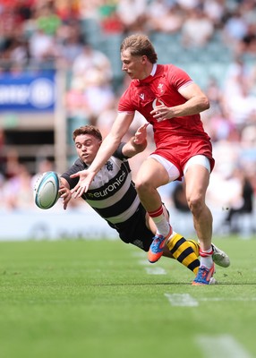 270626 - Barbarians v Wales - Ellis Mee of Wales and Andrew Kellaway of Barbarians compete for the ball