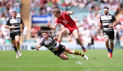 270626 - Barbarians v Wales - Ellis Mee of Wales and Andrew Kellaway of Barbarians compete for the ball