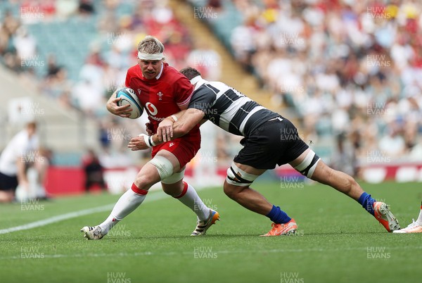 270626 - Barbarians v Wales - Friendly - Aaron Wainwright of Wales is tackled by Lachlan Boshier of Barbarians 