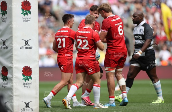 270626 - Barbarians v Wales - Friendly - Reuben Morgan-Williams of Wales celebrates scoring a try with team mates
