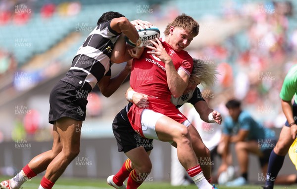 270626 - Barbarians v Wales - Ellis Mee of Wales is tackled by Faf de Klerk of Barbarian FC