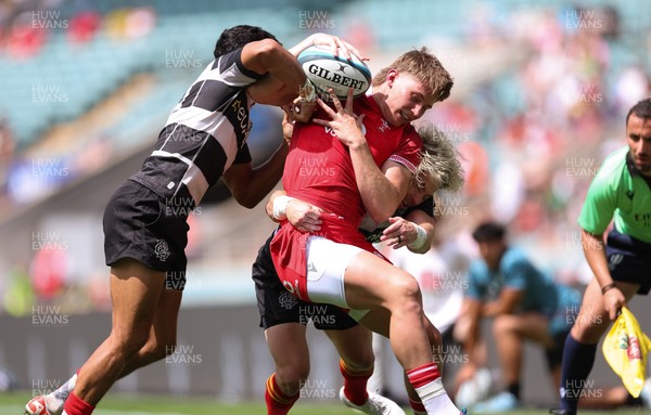 270626 - Barbarians v Wales - Ellis Mee of Wales is tackled by Faf de Klerk of Barbarian FC