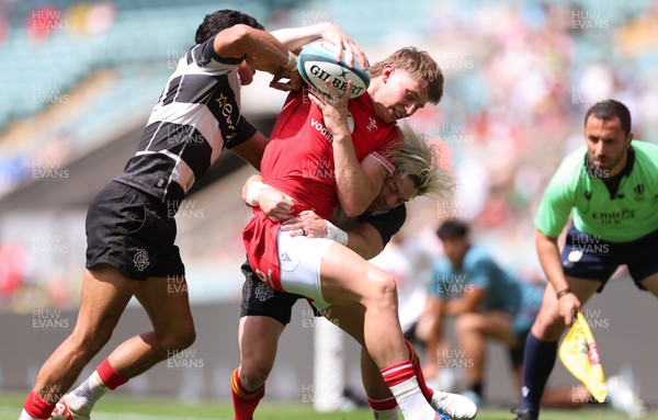 270626 - Barbarians v Wales - Ellis Mee of Wales is tackled by Faf de Klerk of Barbarian FC