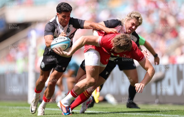 270626 - Barbarians v Wales - Ellis Mee of Wales is tackled by Faf de Klerk of Barbarian FC