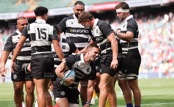 270626 - Barbarians v Wales - George North of Barbarians is mobbed by team mates after he races in to score try