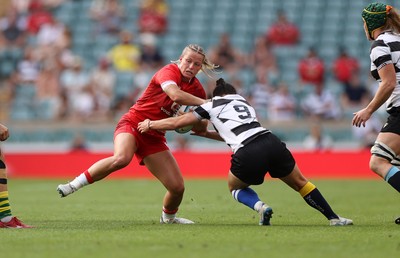 270626 - Barbarians Women v Wales Women - Friendly - Amy Williams of Wales is tackled by Caity Mattinson of Barbarians 