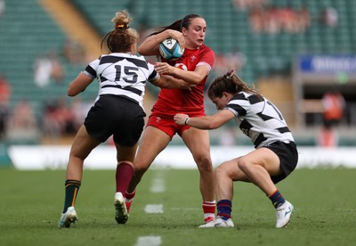 270626 - Barbarians Women v Wales Women - Friendly - Nel Metcalfe of Wales is tackled by Lori Cramer of Barbarians 