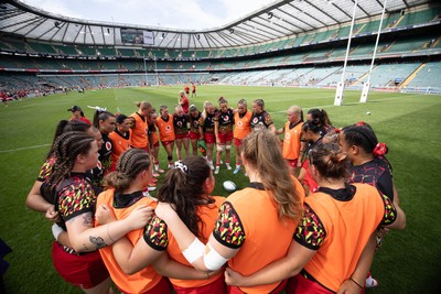 270626 - Barbarians v Wales Women - Wales huddle up ahead of the match
