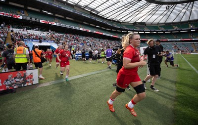 270626 - Barbarians v Wales Women - Alex Callender of Wales leads the team out at the start of the match