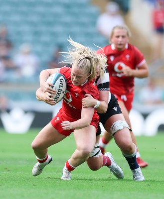 270626 - Barbarians v Wales Women - Seren Lockwood of Wales is tackled