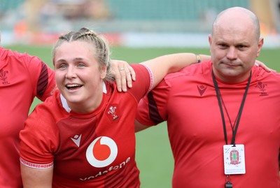 270626 - Barbarians v Wales Women -Alex Callender of Wales and Sean Lynn, Wales Women head coach speak to the players  at the end of the match