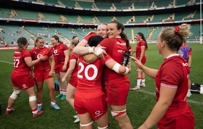 270626 - Barbarians v Wales Women - Alaw Pyrs of Wales, Branwen Metcalfe of Wales and Lucy Isaac of Wales celebrate at the end of the match