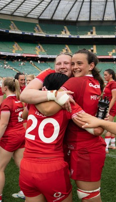 270626 - Barbarians v Wales Women - Alaw Pyrs of Wales, Branwen Metcalfe of Wales and Lucy Isaac of Wales celebrate at the end of the match