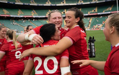 270626 - Barbarians v Wales Women - Alaw Pyrs of Wales, Branwen Metcalfe of Wales and Lucy Isaac of Wales celebrate at the end of the match