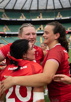 270626 - Barbarians v Wales Women - Alaw Pyrs of Wales, Branwen Metcalfe of Wales and Lucy Isaac of Wales celebrate at the end of the match