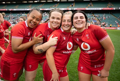 270626 - Barbarians v Wales Women - Jenna De Vera of Wales, Maisie Davies of Wales, Molly Reardon of Wales and Lucy Isaac of Wales celebrate at the end of the match