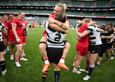 270626 - Barbarians v Wales Women - Wales captain Alex Callender with Welsh team mate Carys Phillips of Barbarians at the end of the match