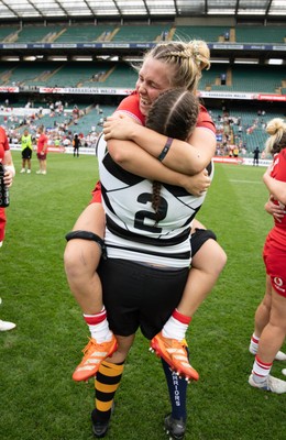 270626 - Barbarians v Wales Women - Wales captain Alex Callender with Welsh team mate Carys Phillips of Barbarians at the end of the match
