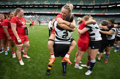 270626 - Barbarians v Wales Women - Wales captain Alex Callender with Welsh team mate Carys Phillips of Barbarians at the end of the match