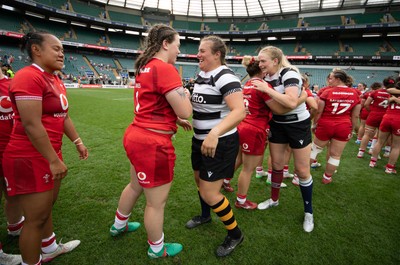 270626 - Barbarians v Wales Women - Maisie Davies of Wales with Welsh team mate Carys Phillips of Barbarians at the end of the match
