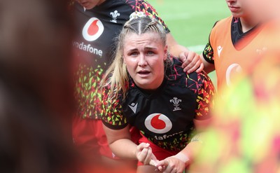 270626 - Barbarians v Wales Women - Alex Callender of Wales speaks to the players ahead of the match