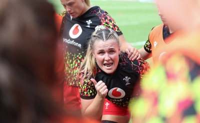 270626 - Barbarians v Wales Women - Alex Callender of Wales speaks to the players ahead of the match