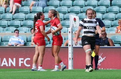 270626 - Barbarians v Wales Women - Amy Williams of Wales is congratulated by Kayleigh Powell of Wales after scoring try