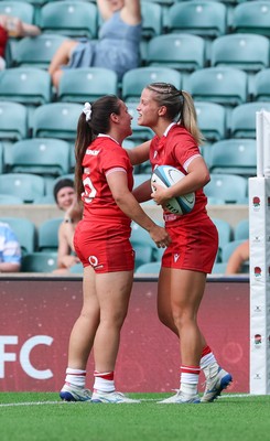 270626 - Barbarians v Wales Women - Amy Williams of Wales is congratulated by Kayleigh Powell of Wales after scoring try