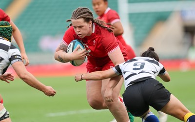 270626 - Barbarians v Wales Women - Maisie Davies of Wales is tackled just short of the line