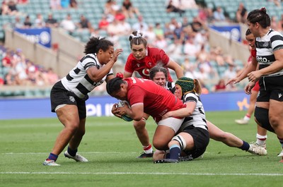 270626 - Barbarians v Wales Women - Sisilia Tuipulotu of Wales is tackled just short of the line