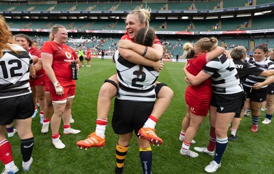 270626 - Barbarians v Wales Women -  Alex Callender of Wales with Wales teammate Carys Phillips of Barbarians