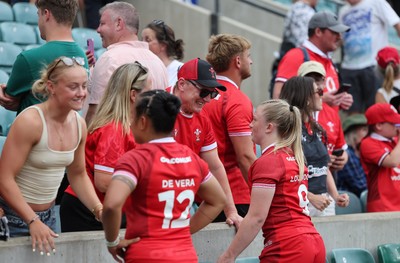 270626 - Barbarians v Wales Women - Jenna De Vera of Wales and Seren Lockwood of Wales speak to family, friends at supporters at the end of the match