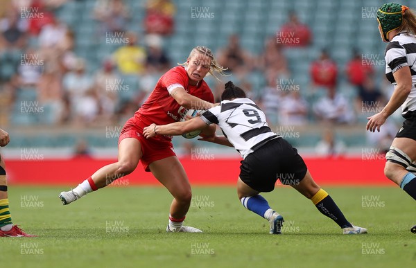 270626 - Barbarians Women v Wales Women - Friendly - Amy Williams of Wales is tackled by Caity Mattinson of Barbarians 