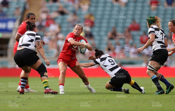 270626 - Barbarians Women v Wales Women - Friendly - Amy Williams of Wales is tackled by Caity Mattinson of Barbarians 