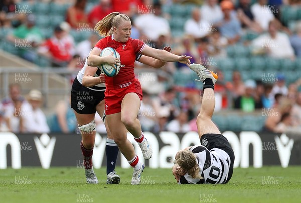 270626 - Barbarians Women v Wales Women - Friendly - Seren Lockwood of Wales is tackled by Liv McGoverne of Barbarians 