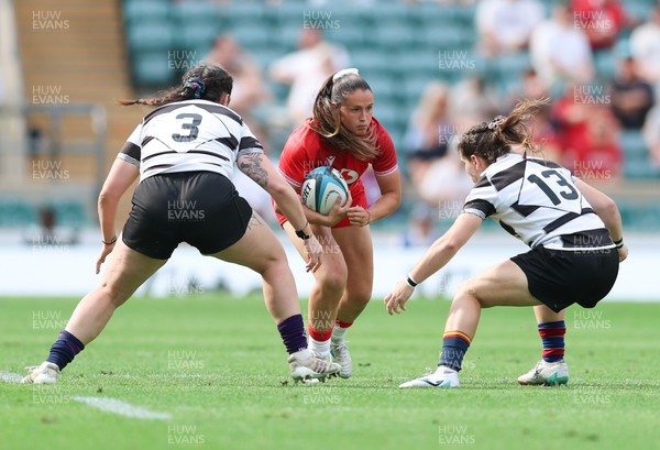 270626 - Barbarians v Wales Women - Kayleigh Powell of Wales takes on Claudia Pena of Barbarians and Christine Belisle of Barbarians