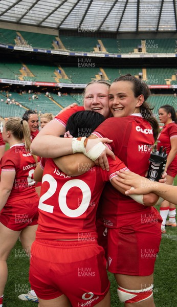 270626 - Barbarians v Wales Women - Alaw Pyrs of Wales, Branwen Metcalfe of Wales and Lucy Isaac of Wales celebrate at the end of the match