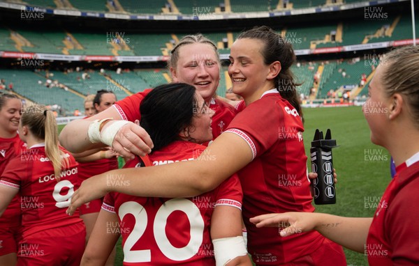 270626 - Barbarians v Wales Women - Alaw Pyrs of Wales, Branwen Metcalfe of Wales and Lucy Isaac of Wales celebrate at the end of the match