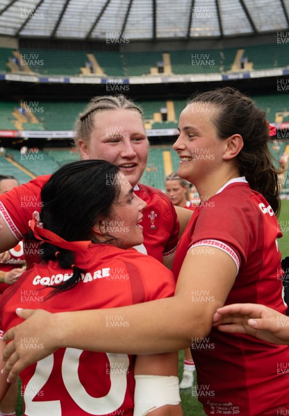 270626 - Barbarians v Wales Women - Alaw Pyrs of Wales, Branwen Metcalfe of Wales and Lucy Isaac of Wales celebrate at the end of the match