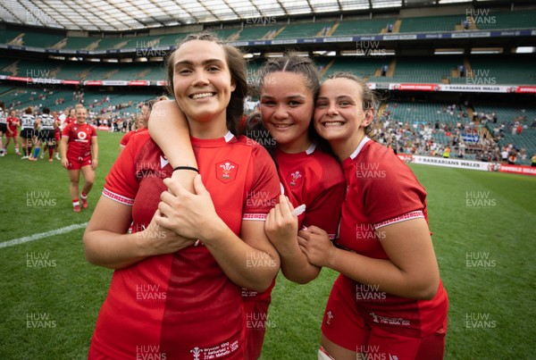 270626 - Barbarians v Wales Women - Bryonie King of Wales, Jorja Aiono of Wales and Branwen Metcalfe of Wales celebrate at the end of the match