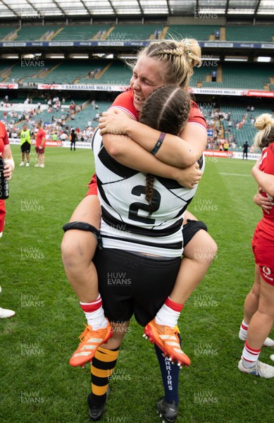 270626 - Barbarians v Wales Women - Wales captain Alex Callender with Welsh team mate Carys Phillips of Barbarians at the end of the match