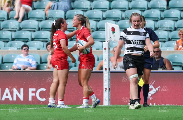 270626 - Barbarians v Wales Women - Amy Williams of Wales is congratulated by Kayleigh Powell of Wales after scoring try
