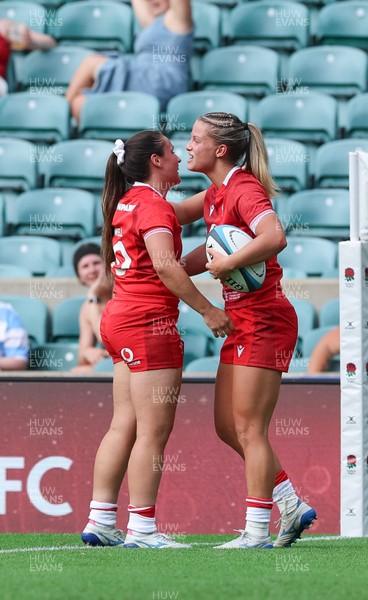 270626 - Barbarians v Wales Women - Amy Williams of Wales is congratulated by Kayleigh Powell of Wales after scoring try