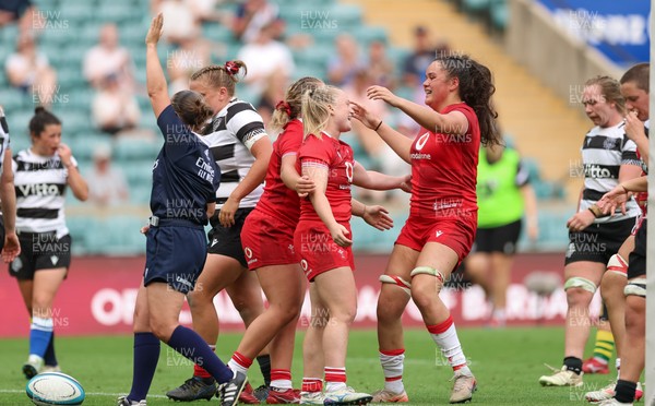 270626 - Barbarians v Wales Women - Seren Lockwood of Wales celebrates with Jorja Aiono of Wales after scoring try