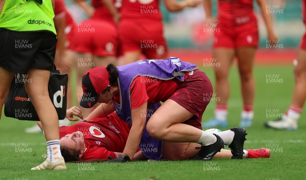 270626 - Barbarians v Wales Women - Nel Metcalfe of Wales receives treatment after picking up an injury