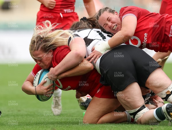 270626 - Barbarians v Wales Women - Kelsey Jones of Wales is tackled just short of the line