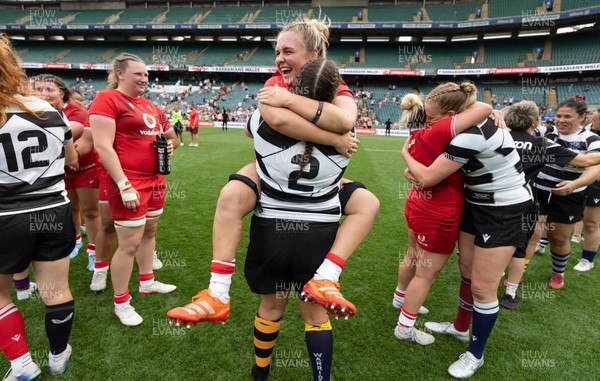 270626 - Barbarians v Wales Women -  Alex Callender of Wales with Wales teammate Carys Phillips of Barbarians